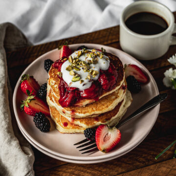 pancakes on a plate with strawberry compote