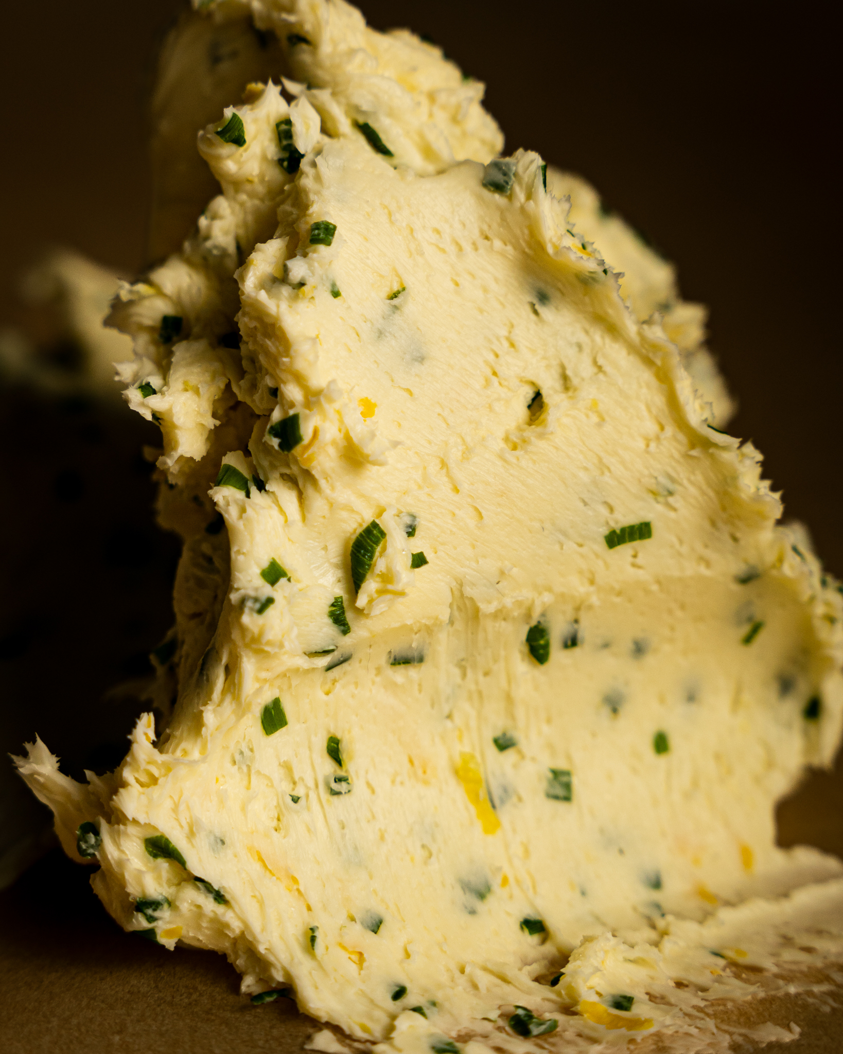 Butter with pieces of chives and lemon zest
